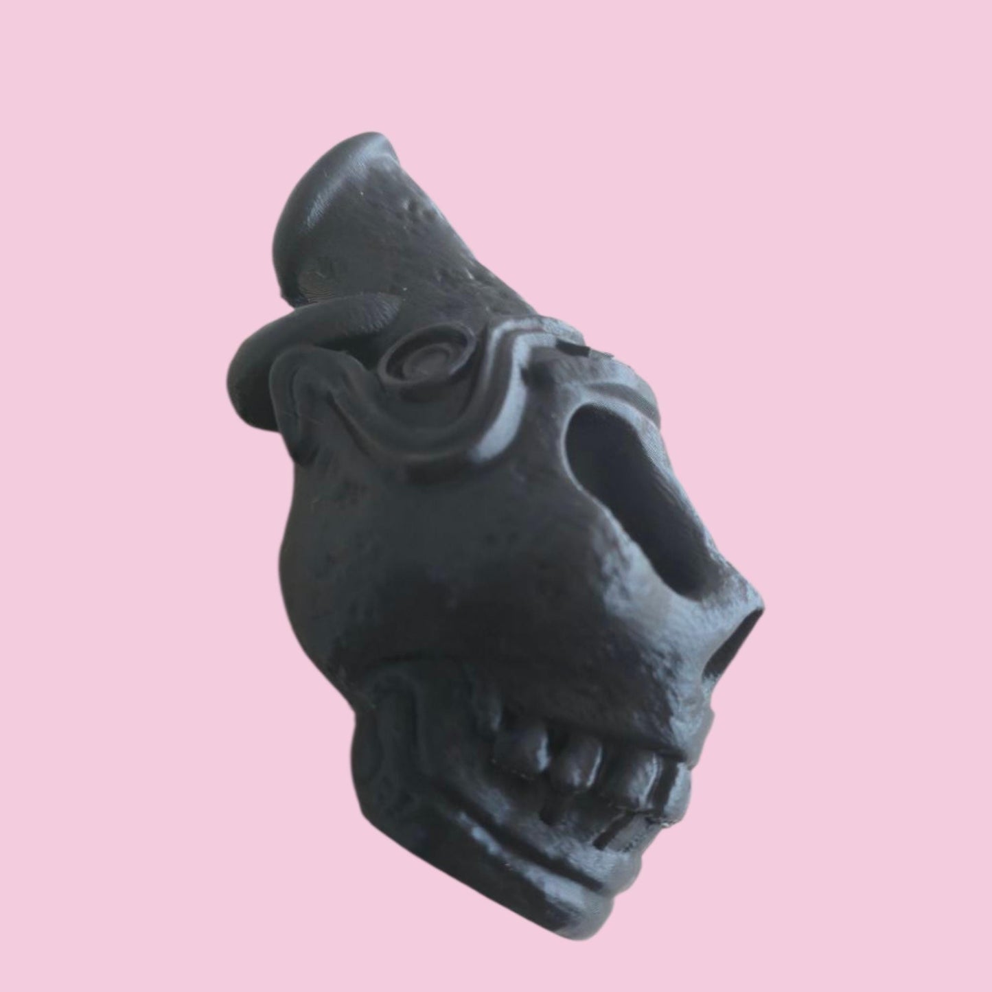 Blow the bone-chilling scream of the ancients. This handcrafted Aztec death whistle delivers a terrifying sound. A unique gift, replica, or tribal decor piece.